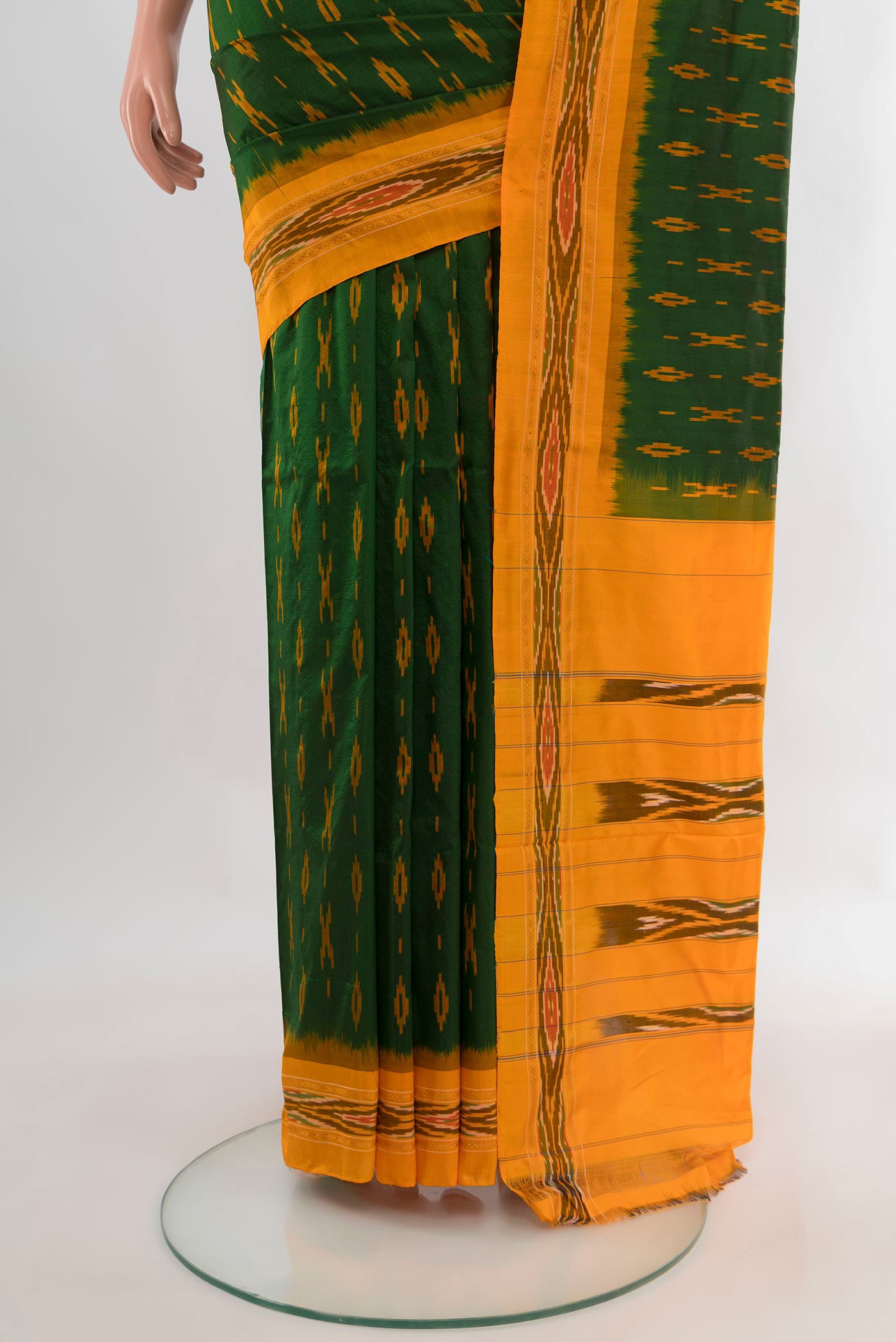 Pleats and pallu of Pure Silk Bottle Green Pochampally Saree with Ikat Print on the body and Ikat Border. 