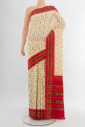 Cream Pochampally Silk Saree with Ikat design on the body and Ikat Border.  displayed on a mannequin