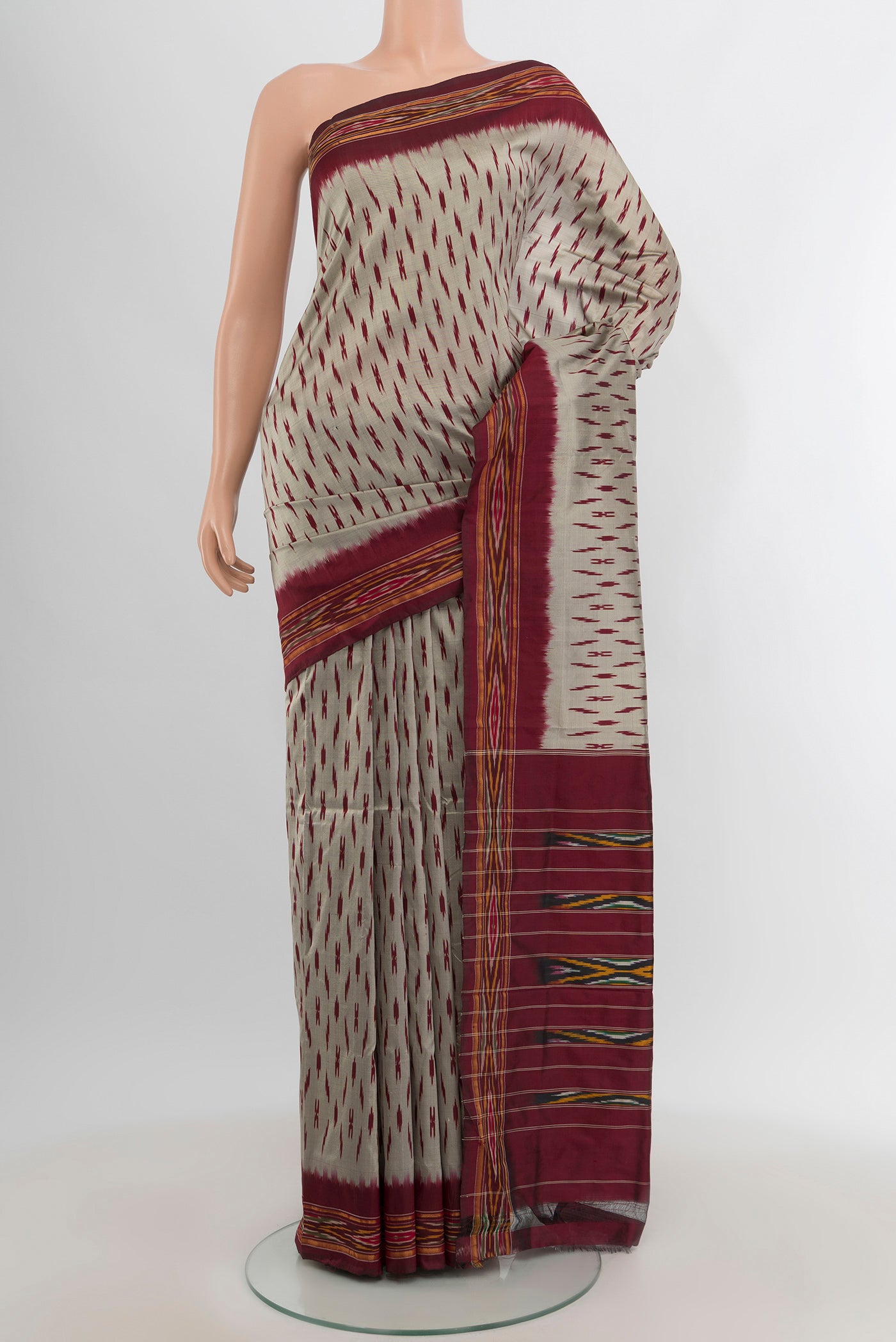Davys Grey Pochampally Silk Saree with Ikat design on the body and Zari Border.  displayed on a mannequin