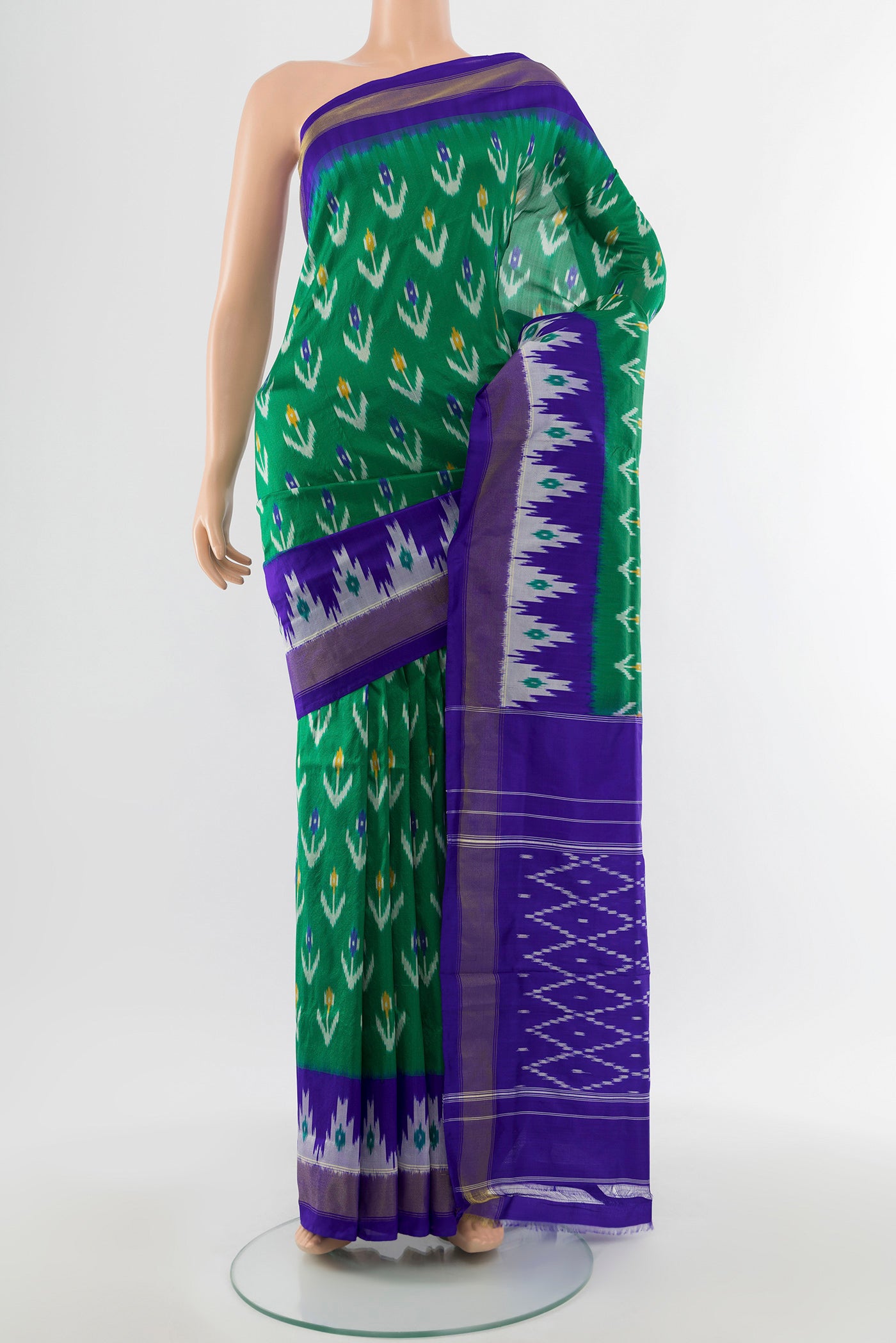 Sage Green Pochampally Saree with Ikat Print on the body and Silk Border.  displayed on a mannequin