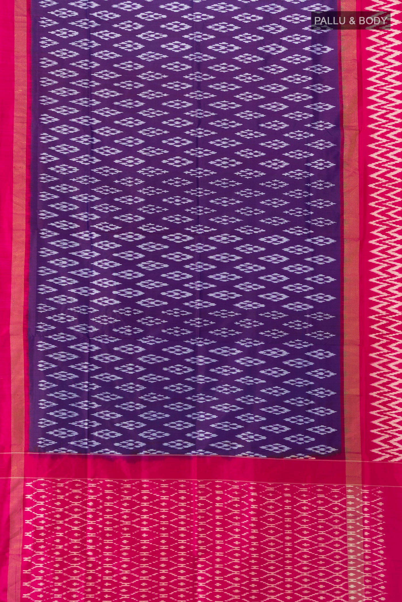 Flat view of Dark Blue Rajkot Patola Silk Saree with Ikat Print on the body and Silk Border. 