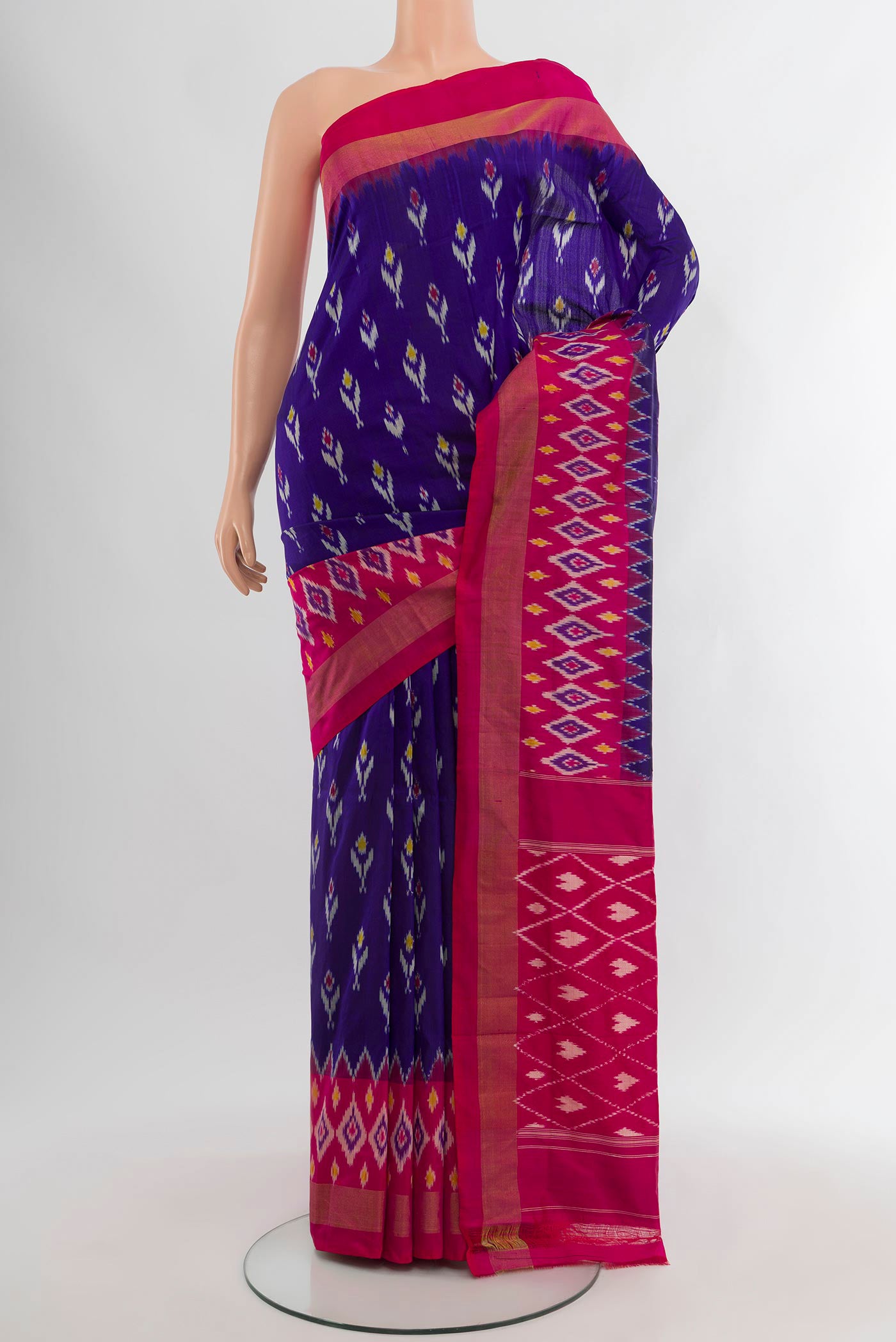 Dark Blue Pochampally Silk Saree with Ikat design on the body and Ikat Border.  displayed on a mannequin