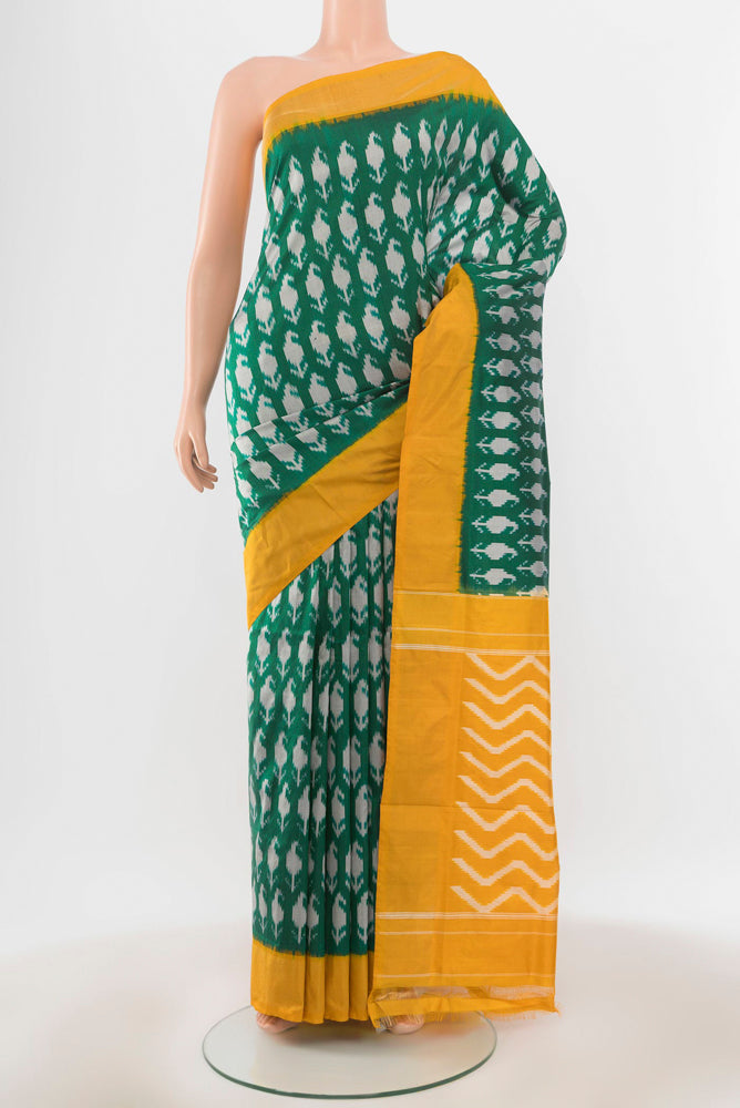 Pure Silk Pure Zari Mint Green Pochampally Saree with Ikat Print on the body and Silk Border.  displayed on a mannequin