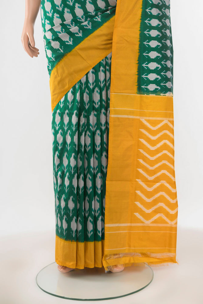 Pleats and pallu of Pure Silk Pure Zari Mint Green Pochampally Saree with Ikat Print on the body and Silk Border. 