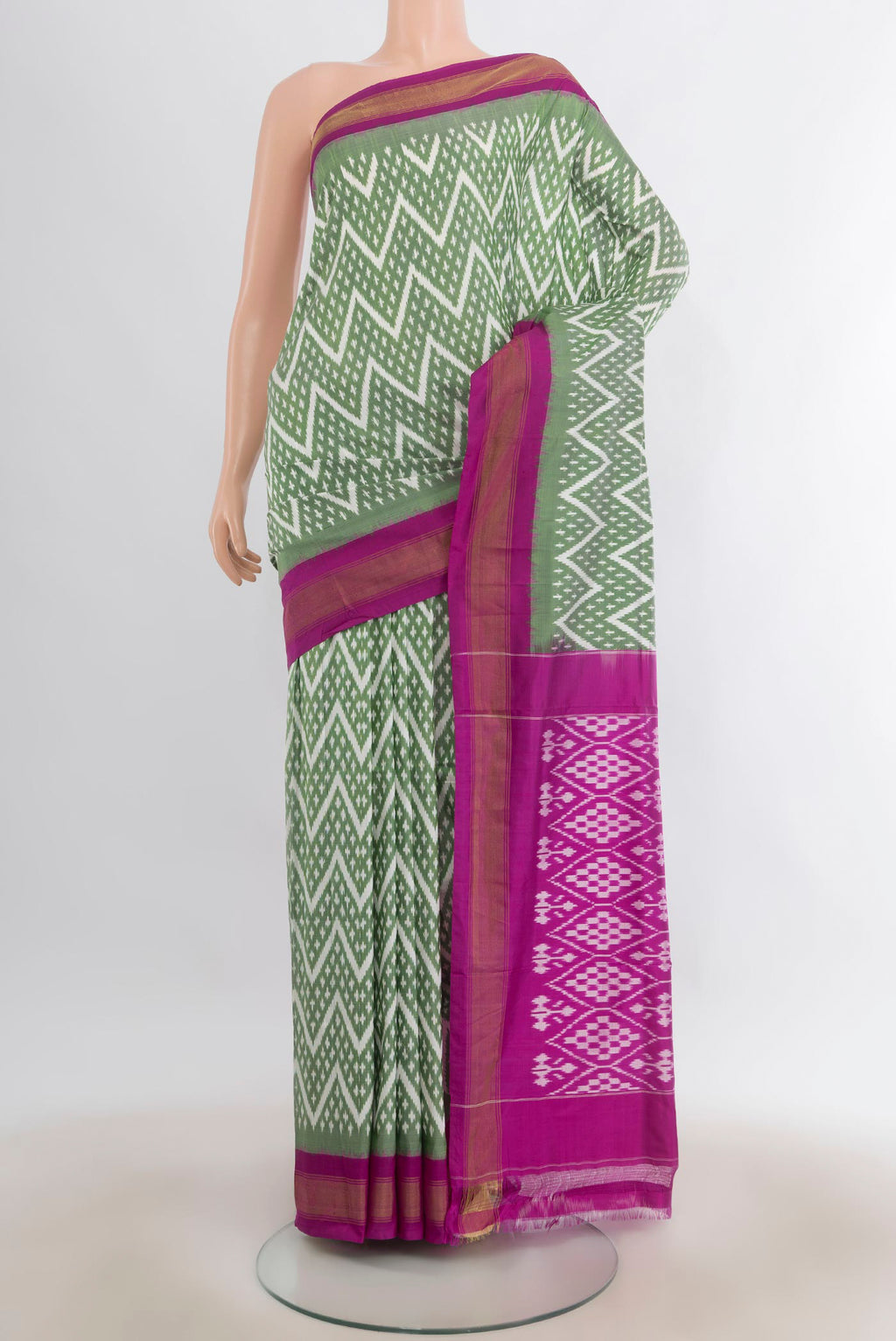 Pure Silk Light Green Pochampally Saree with Pure Ikat on the body and Zari Border.  displayed on a mannequin