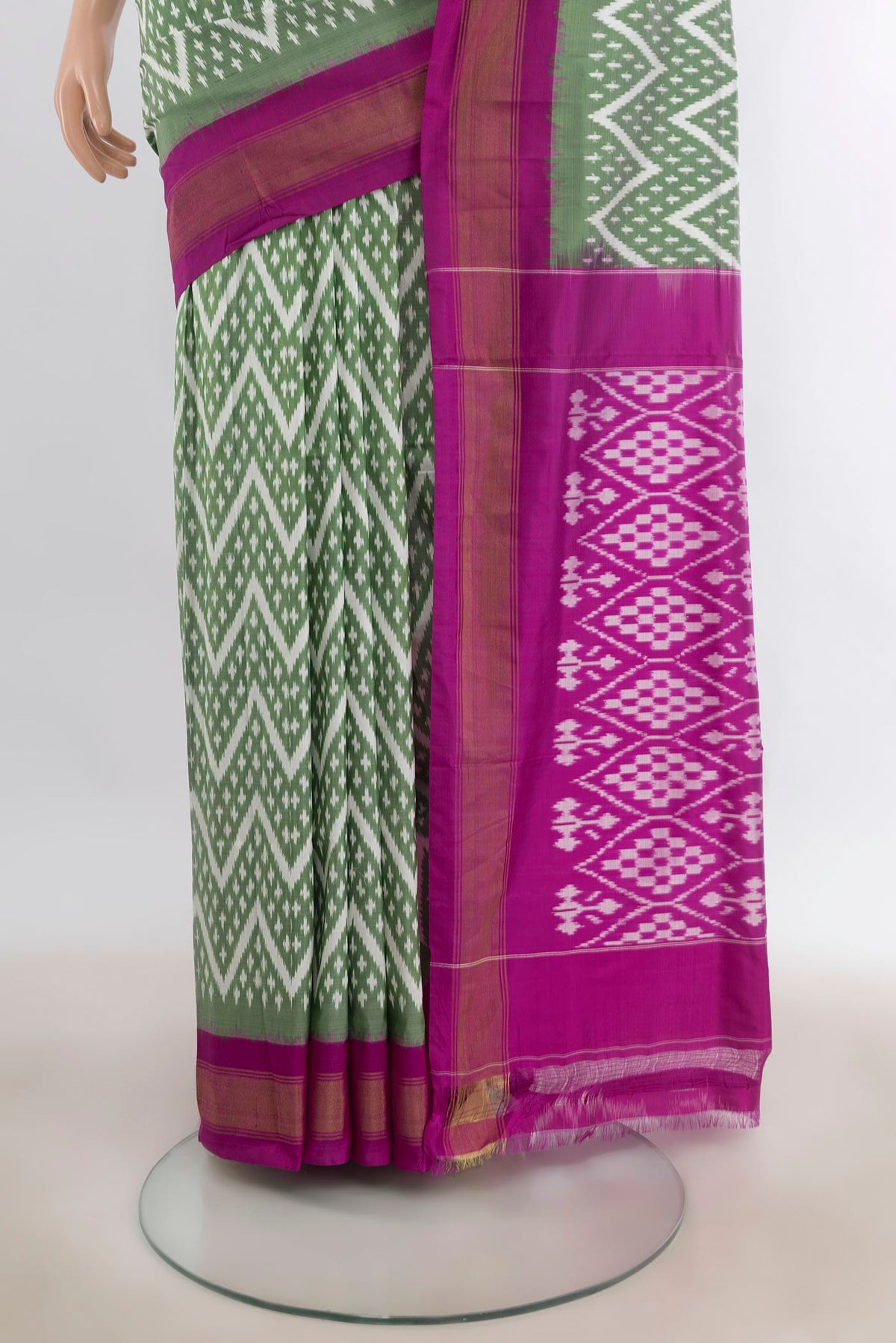 Pleats and pallu of Pure Silk Light Green Pochampally Saree with Pure Ikat on the body and Zari Border. 