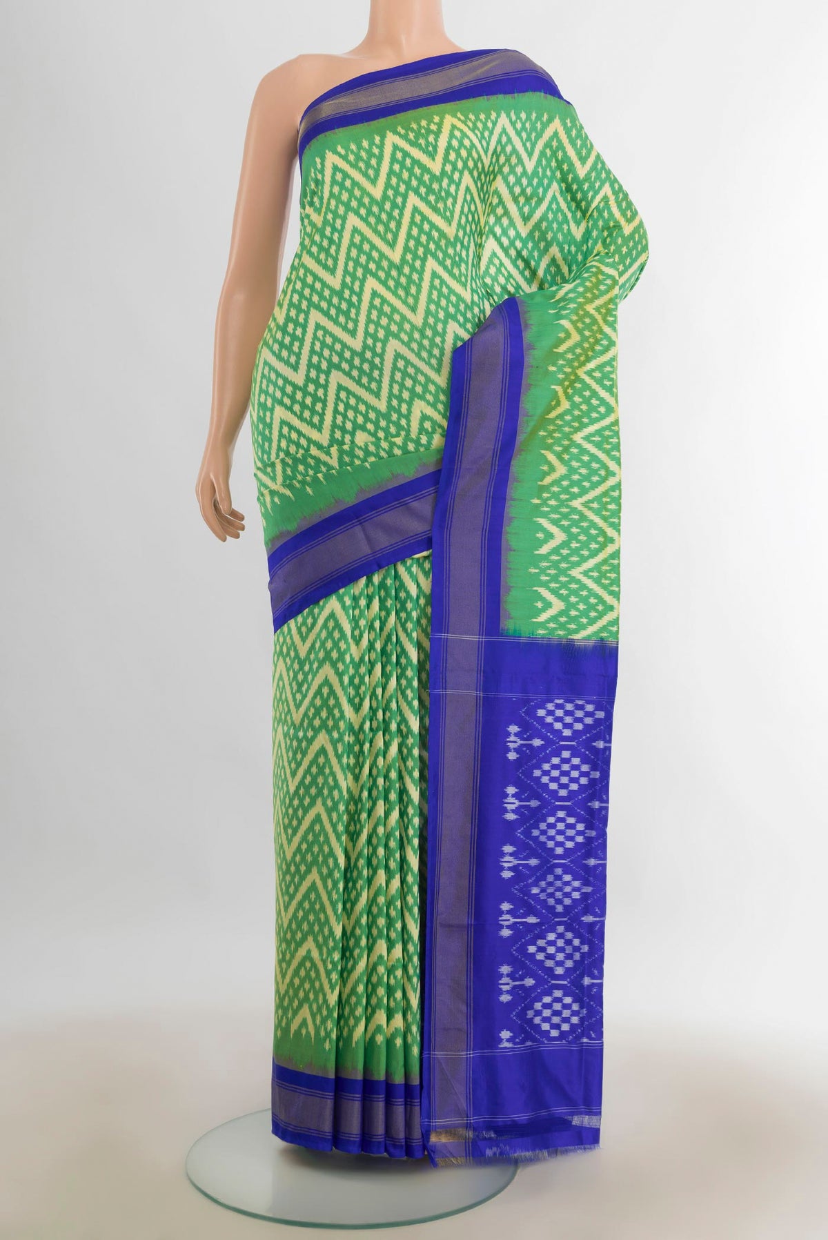 Pure Silk Multi Color Pochampally Saree with Ikat Print on the body and Silk Border.  displayed on a mannequin