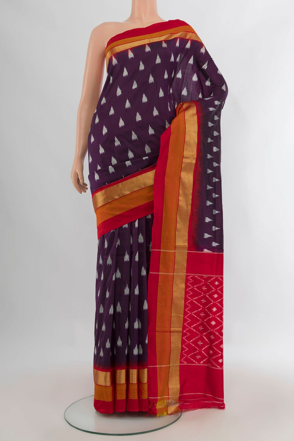 Pure Silk Coffee Brown Pochampally Saree with Ikat design on the body and Zari Border.  displayed on a mannequin