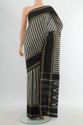 Multi Color Pochampally Silk Saree with Checked design on the body and Zari Border.  displayed on a mannequin