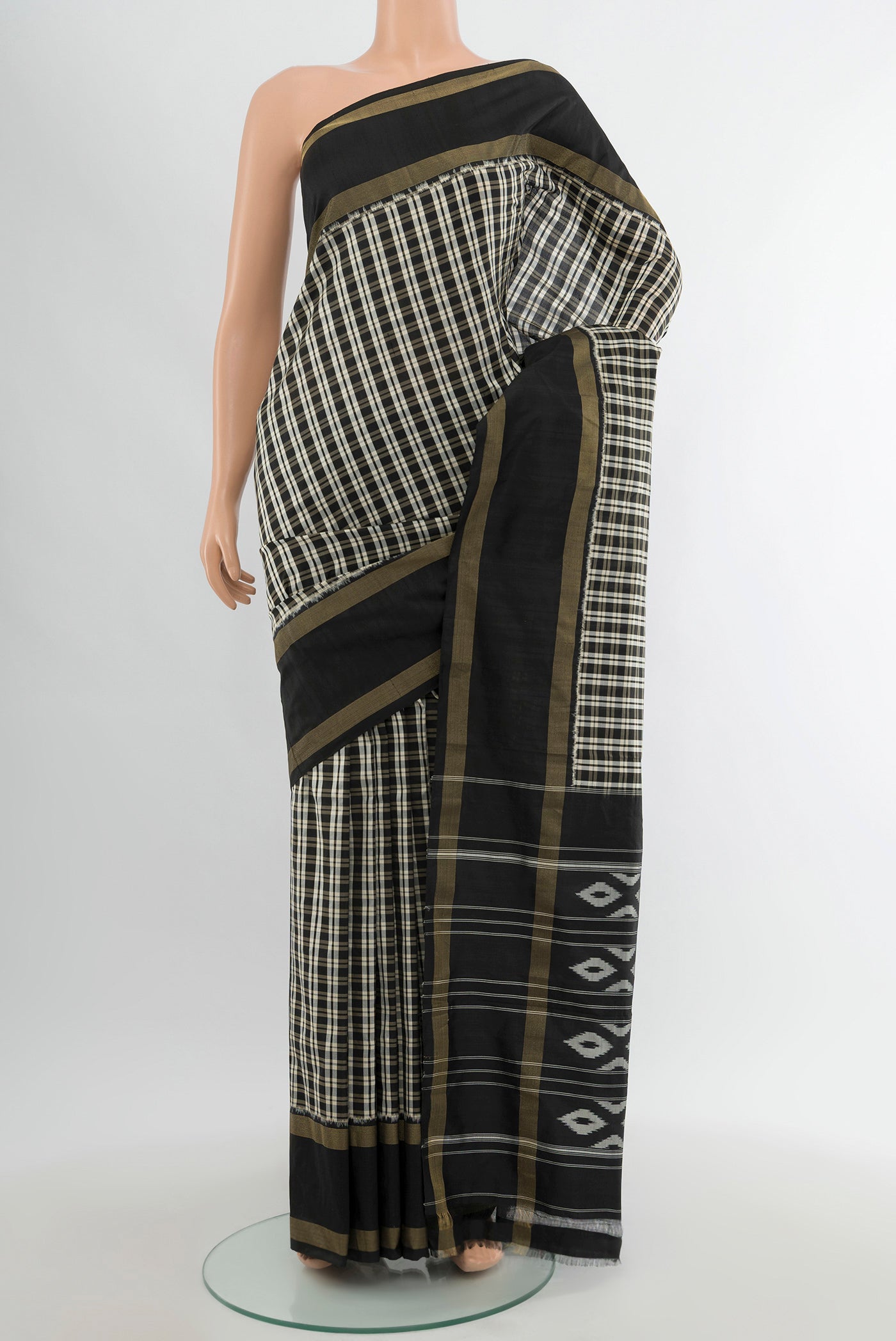 Multi Color Pochampally Silk Saree with Checked design on the body and Zari Border.  displayed on a mannequin