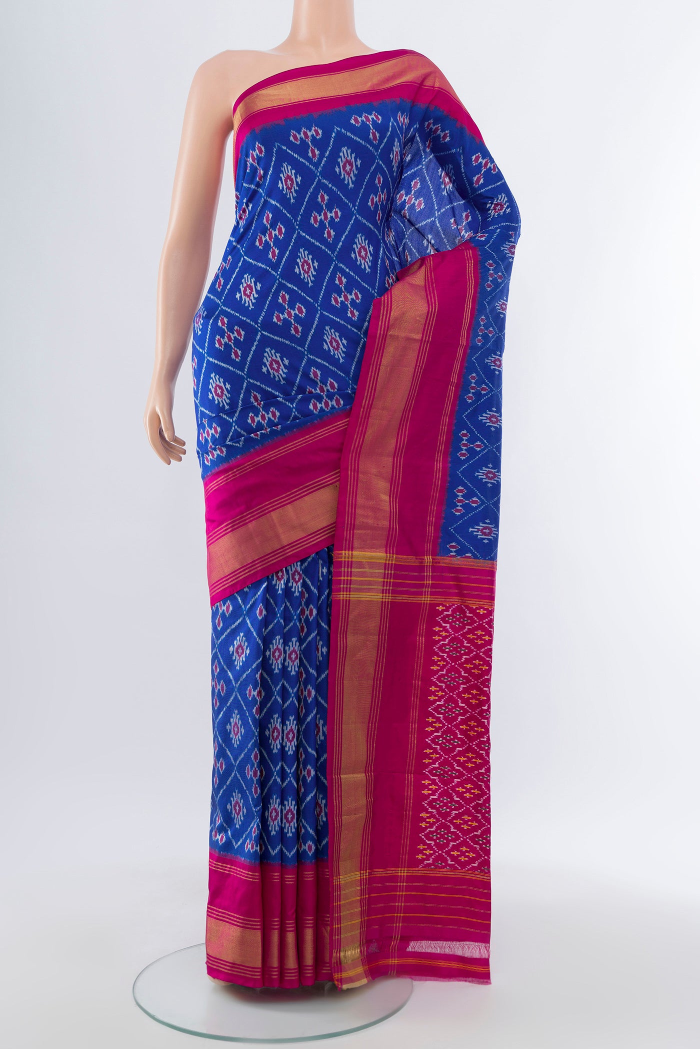 Dark Blue Pochampally Saree with Ikat Print on the body and Silk Border.  displayed on a mannequin