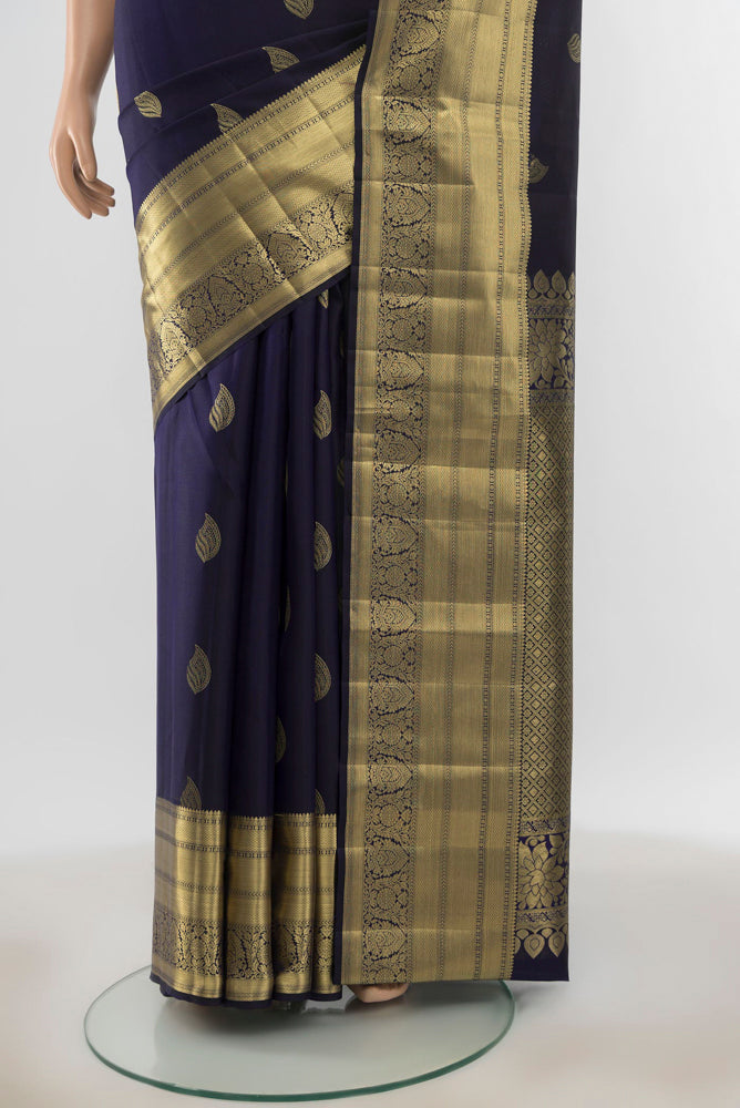 Pleats and pallu of Pure Silk Pure Zari Navy Blue Kanjivaram Saree with Zari Butta on the body and Silk Border. 