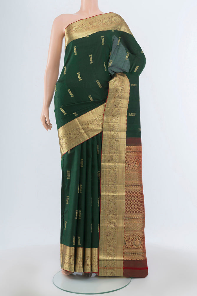 Mint Green Kanjivaram Silk Saree with Plain Body and Silk Border.  displayed on a mannequin