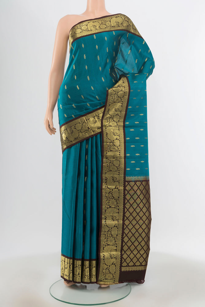 Pure Silk Pure Zari Dark Blue Kanchipuram Saree with Zari Butta on the body and Silk Border.  displayed on a mannequin