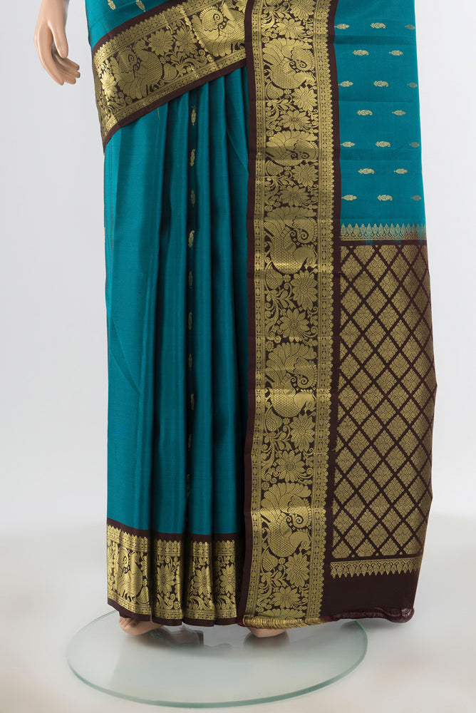 Pleats and pallu of Pure Silk Pure Zari Dark Blue Kanchipuram Saree with Zari Butta on the body and Silk Border. 