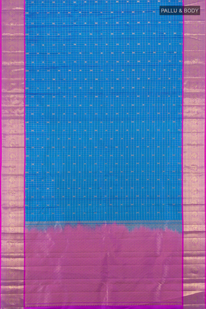 Flat view of Pure Silk Pure Zari Light Blue Kanchipuram Saree with Zari Butta on the body and Silk Border. 