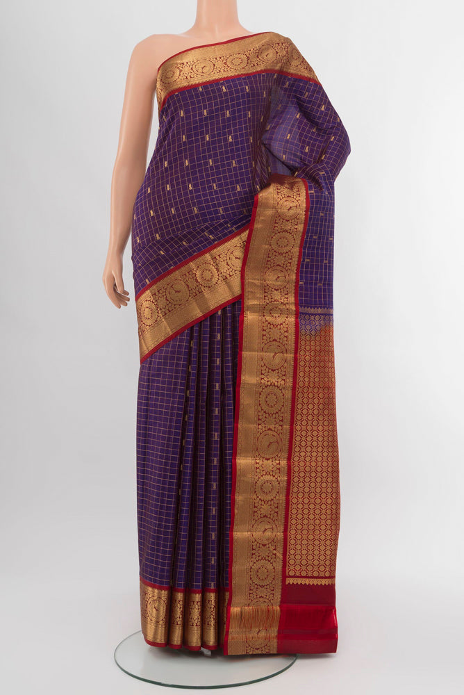 Violet Kanchipuram Silk Saree with Zari Brocade on the body and Silk Border.  displayed on a mannequin