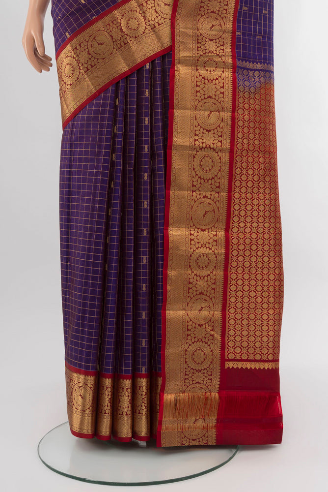 Pleats and pallu of Violet Kanchipuram Silk Saree with Zari Brocade on the body and Silk Border. 