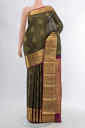 Pure Silk Pure Zari Coffee Brown Kanchipuram Saree with Zari Butta on the body and Silk Border.  displayed on a mannequin