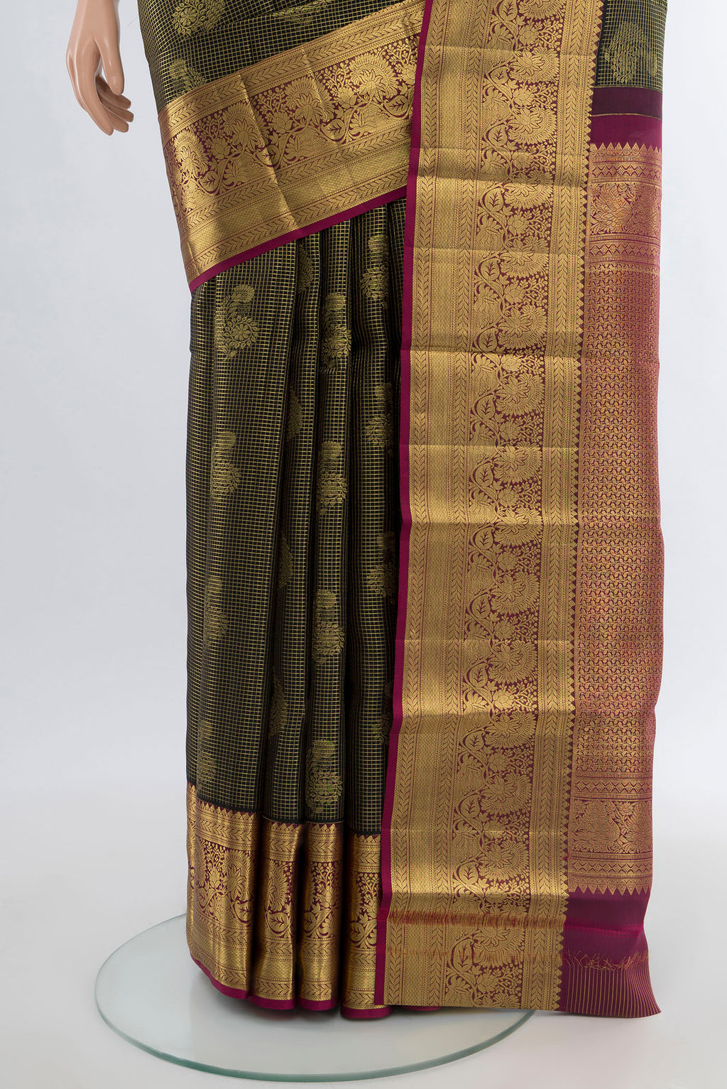 Pleats and pallu of Pure Silk Pure Zari Coffee Brown Kanchipuram Saree with Zari Butta on the body and Silk Border. 