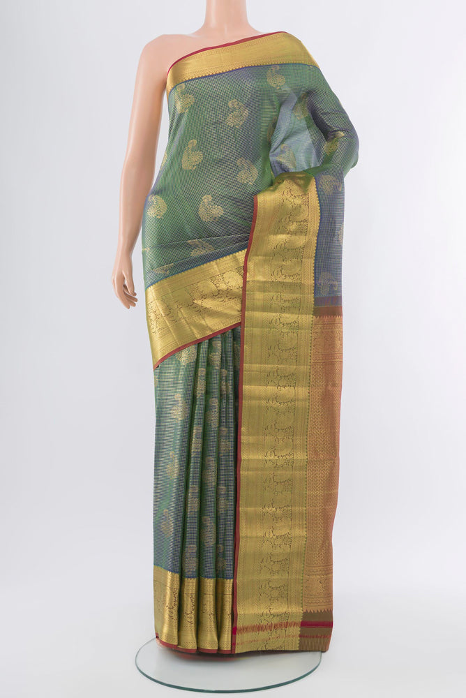 Golden Kanchipuram Silk Saree with Zari Butta on the body and Silk Border.  displayed on a mannequin