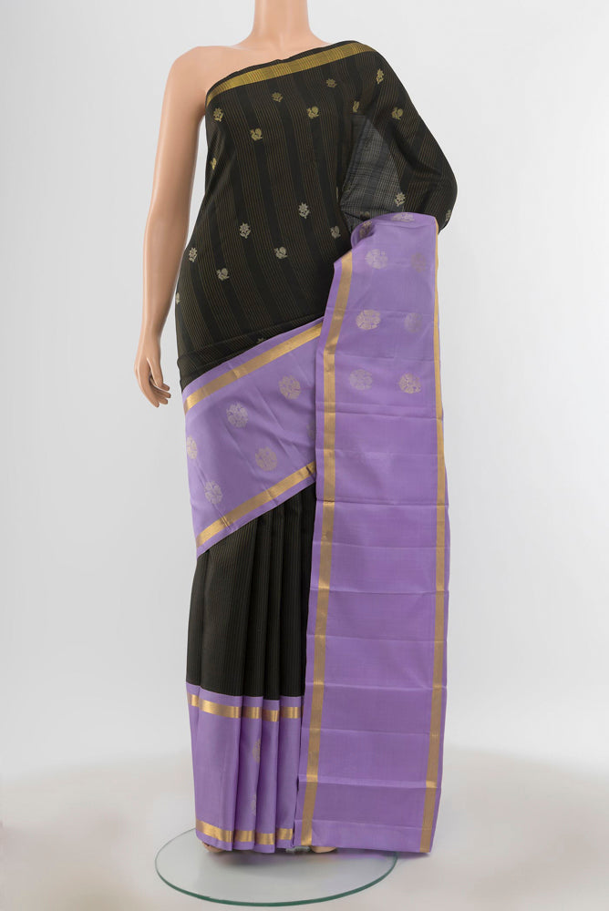 Pure Silk Pure Zari Black Kanjivaram Saree with Zari Butta on the body and Silk Border.  displayed on a mannequin