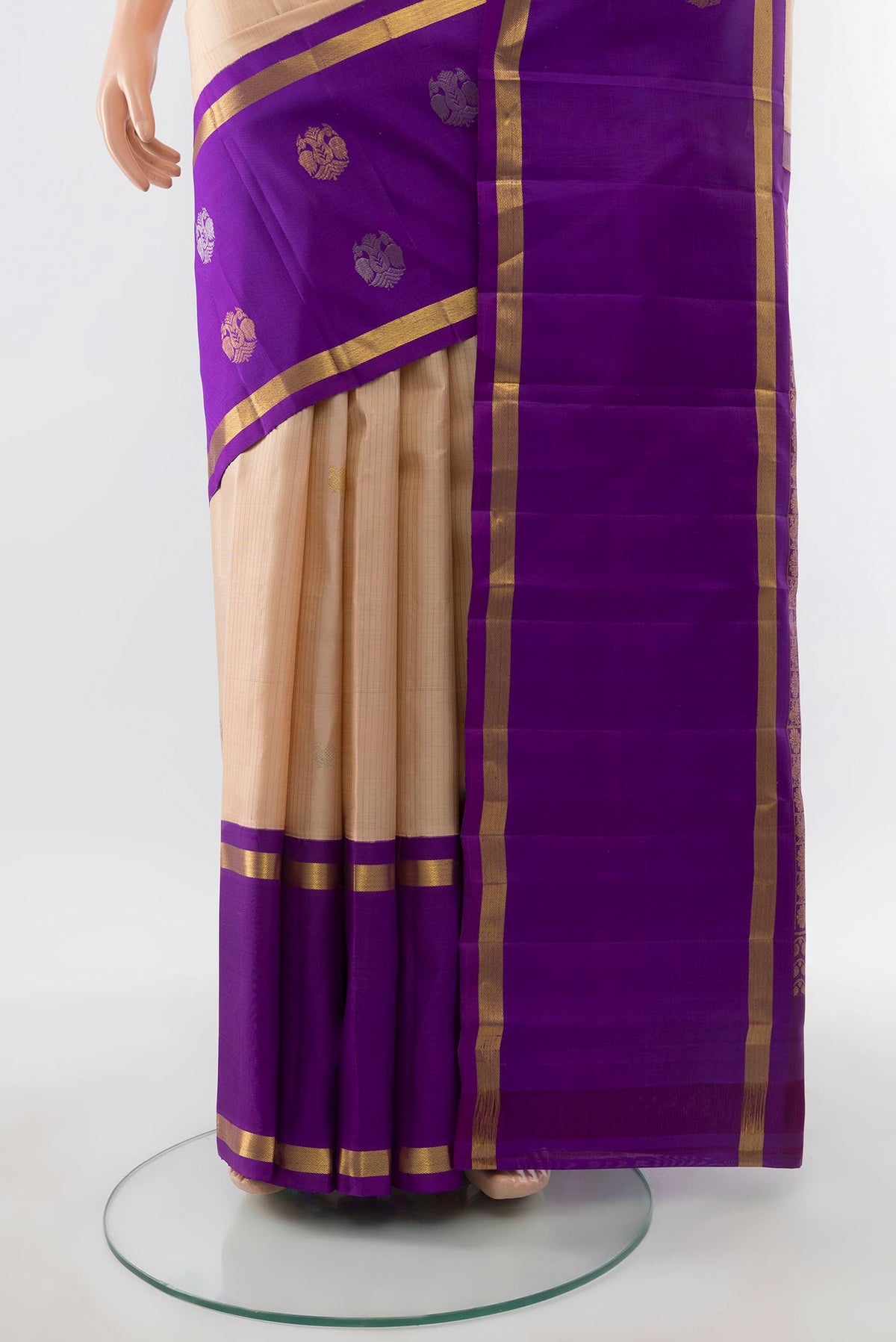 Pleats and pallu of Cream Kanjivaram Silk Saree with Zari Butta on the body and Fancy Border. 