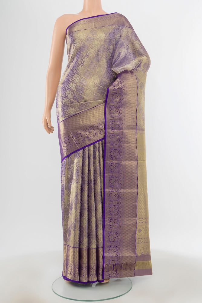 Golden Kanjivaram Silk Saree with Plain Body and Silk Border.  displayed on a mannequin