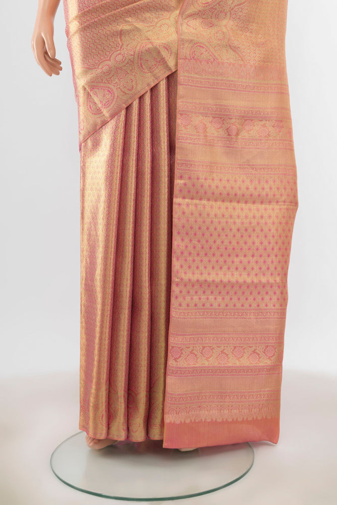 Pleats and pallu of Golden Peach Kanjivaram Silk Saree with Zari Butta on the body and Silk Border. 