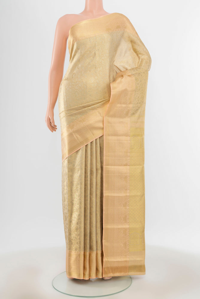 Pure Silk Pure Zari Golden Kanjivaram Saree with Zari Butta on the body and Silk Border.  displayed on a mannequin