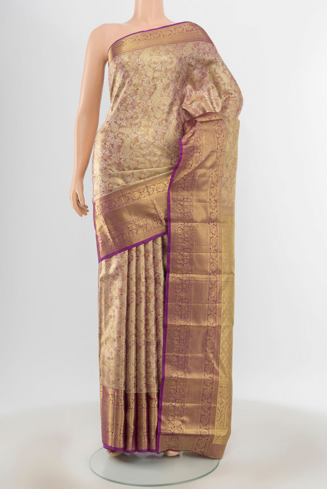 Pure Silk Pure Zari Golden Kanchipuram Saree with Zari Butta on the body and Silk Border.  displayed on a mannequin
