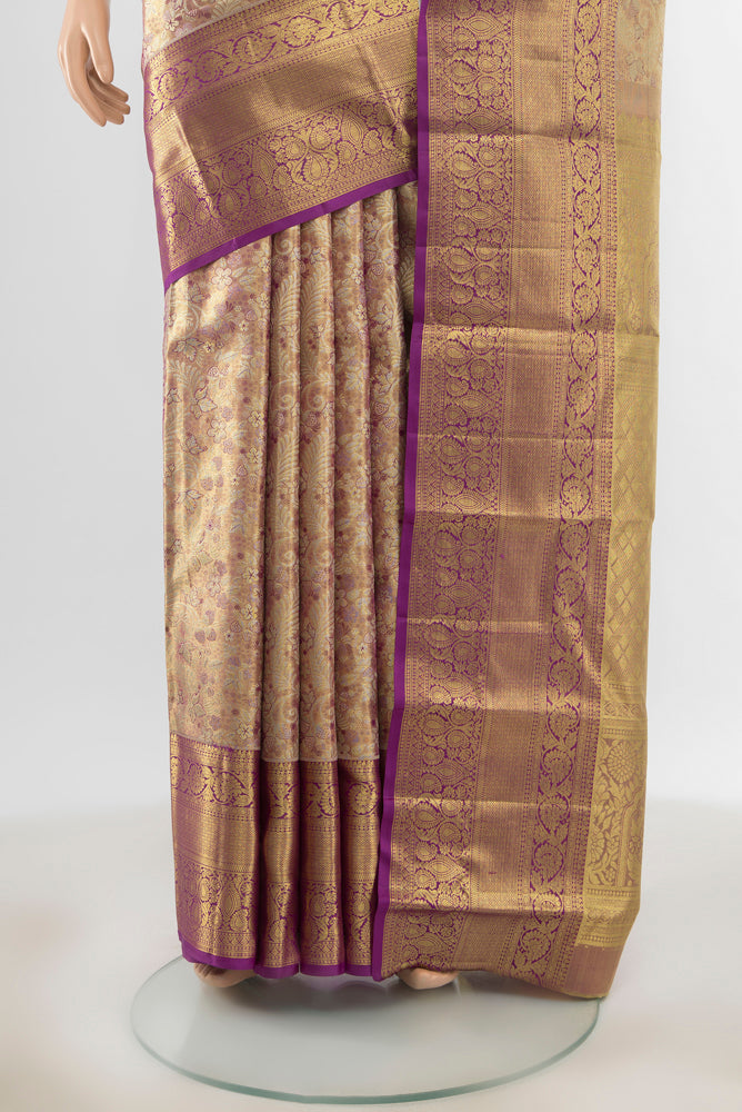 Pleats and pallu of Pure Silk Pure Zari Golden Kanchipuram Saree with Zari Butta on the body and Silk Border. 