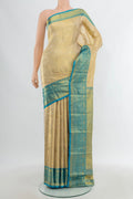 Golden Kanchipuram Tissue Silk Saree with Zari Brocade on the body and Zari Border.  displayed on a mannequin