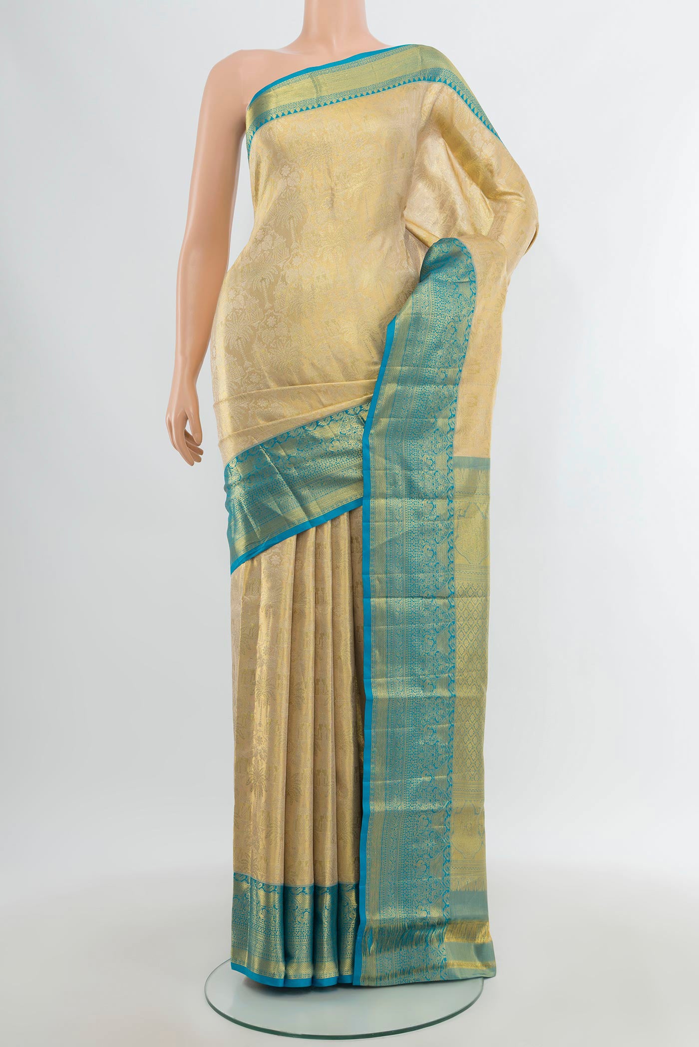 Golden Kanchipuram Tissue Silk Saree with Zari Brocade on the body and Zari Border.  displayed on a mannequin