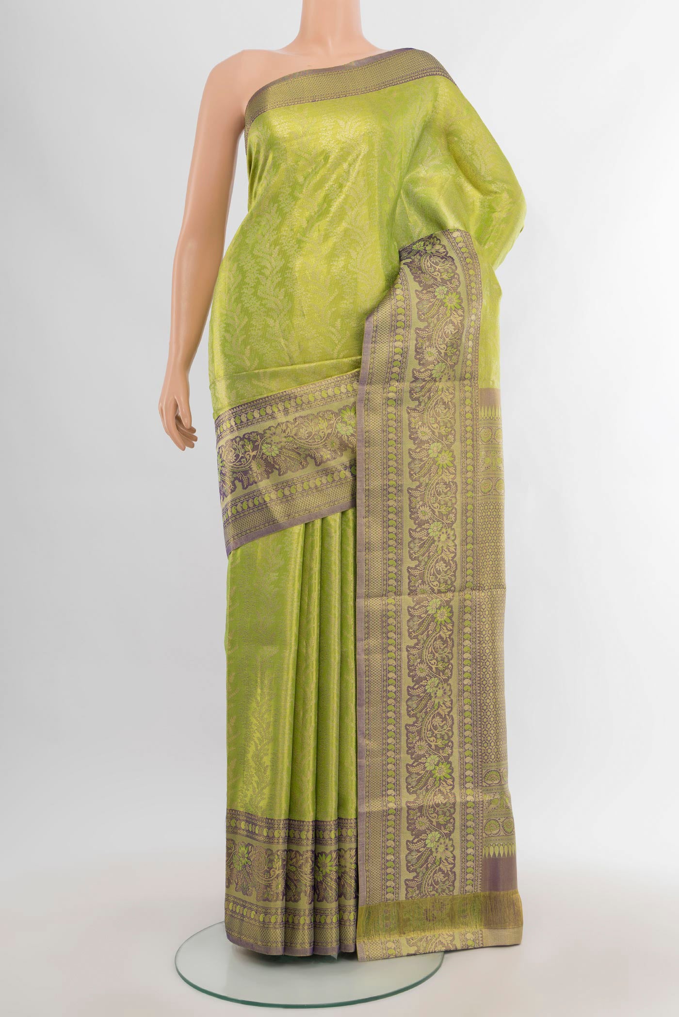 Parrot Green Kanchipuram Tissue Silk Saree with Zari Brocade on the body and Zari Border.  displayed on a mannequin