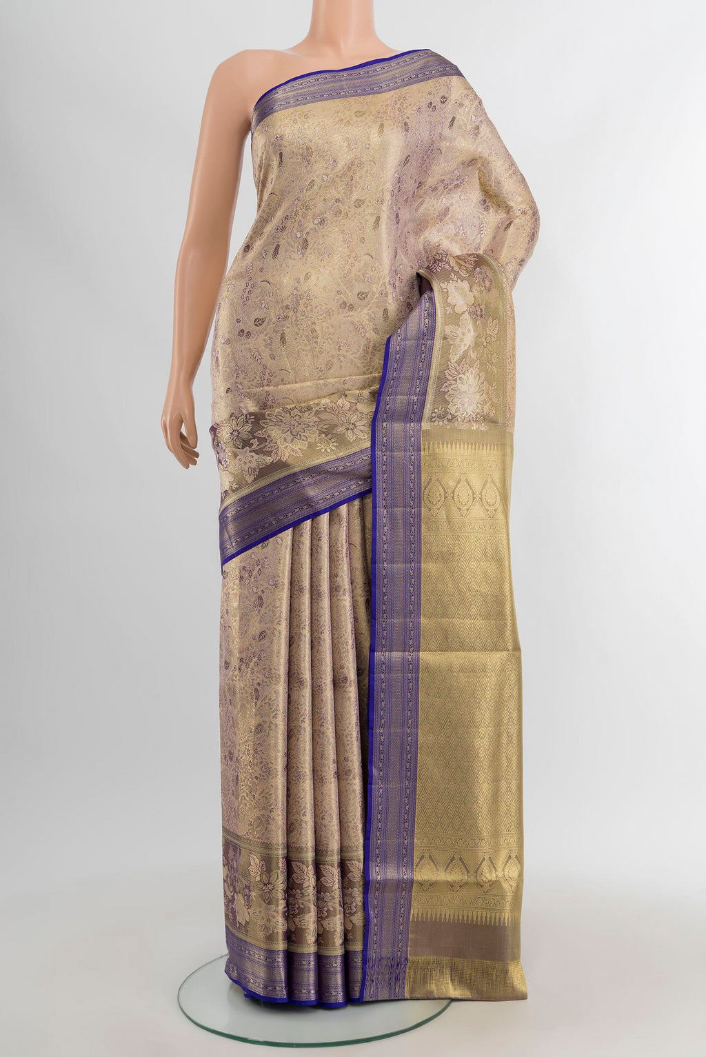 Silver Kanchipuram Tissue Silk Saree with Zari Butta on the body and Zari Border.  displayed on a mannequin