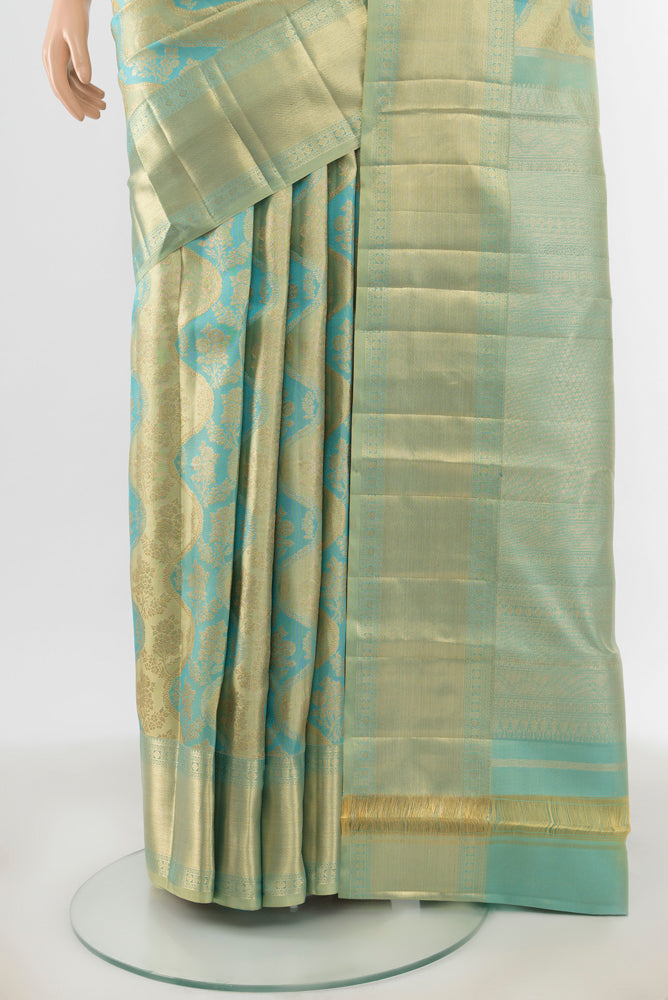 Pleats and pallu of Golden Kanjivaram Silk Saree with Zari Butta on the body and Silk Border. 