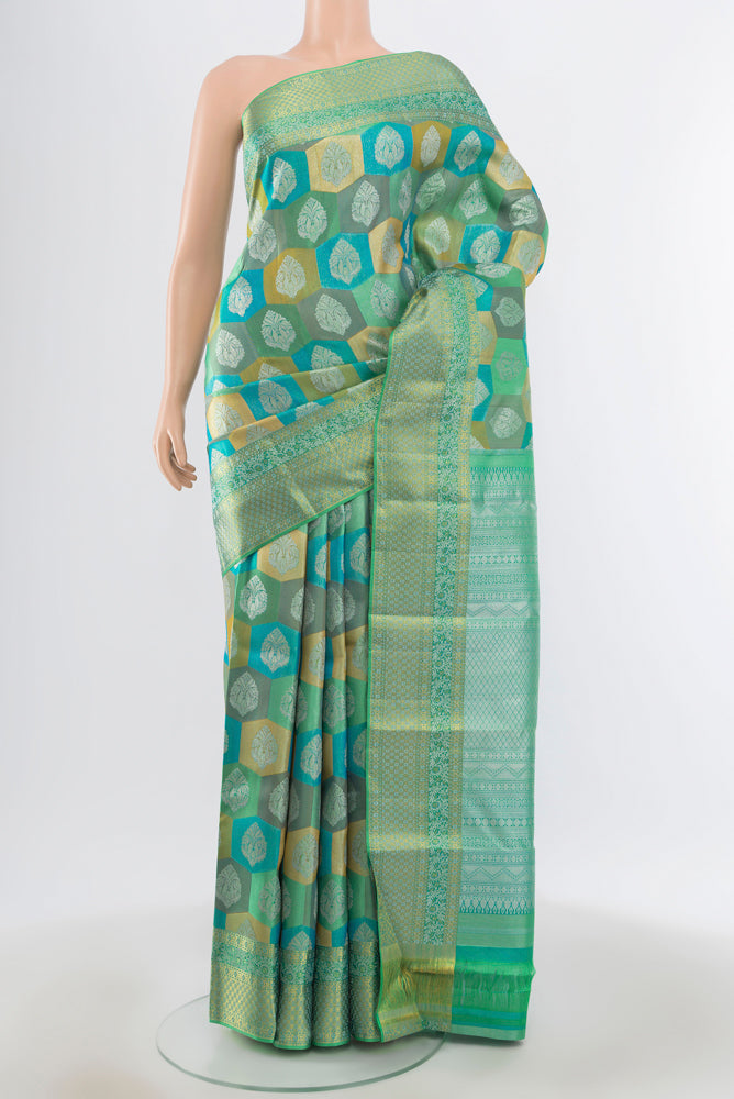 Pure Silk Pure Zari Multi Color Kanjivaram Saree with Zari Butta on the body and Silk Border.  displayed on a mannequin