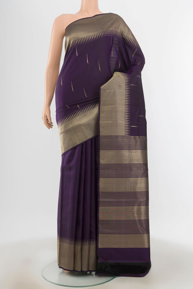Violet Kanchipuram Silk Saree with Zari Butta on the body and Silk Border.  displayed on a mannequin