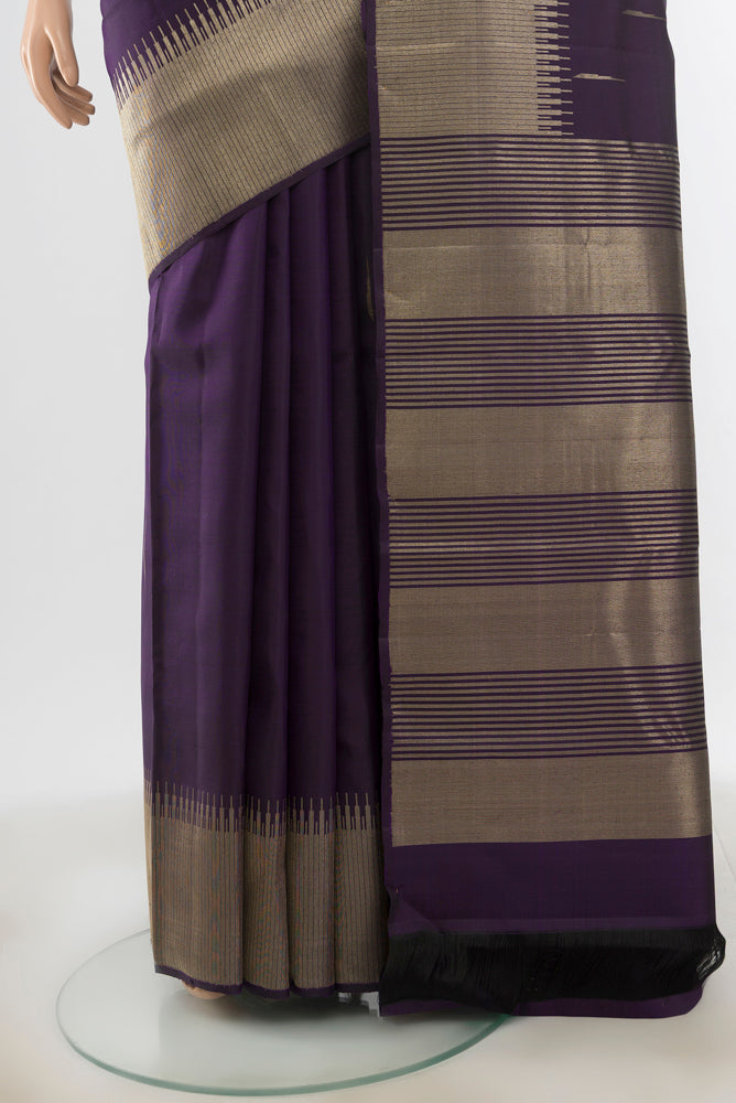 Pleats and pallu of Violet Kanchipuram Silk Saree with Zari Butta on the body and Silk Border. 