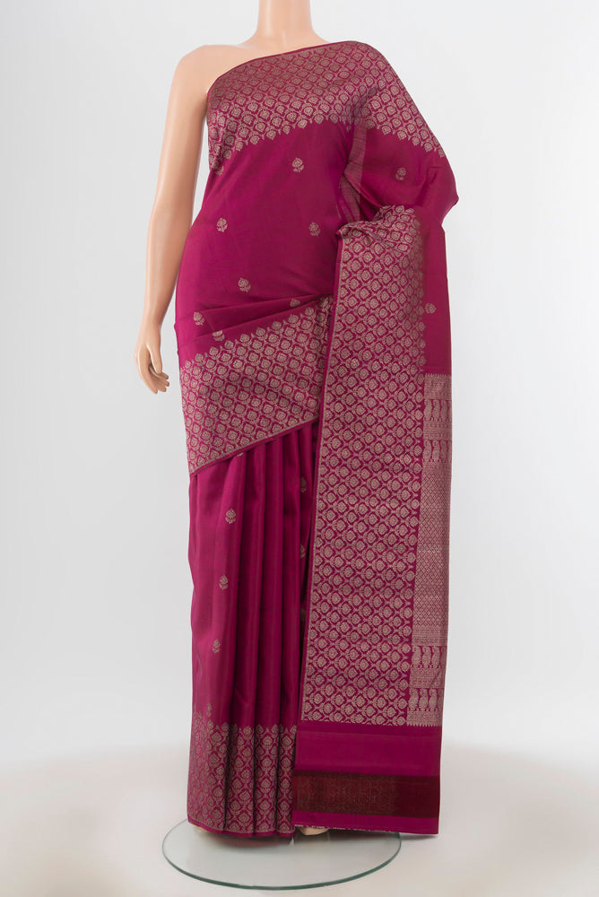 Purple Kanchipuram Silk Saree with Zari Butta on the body and Silk Border.  displayed on a mannequin