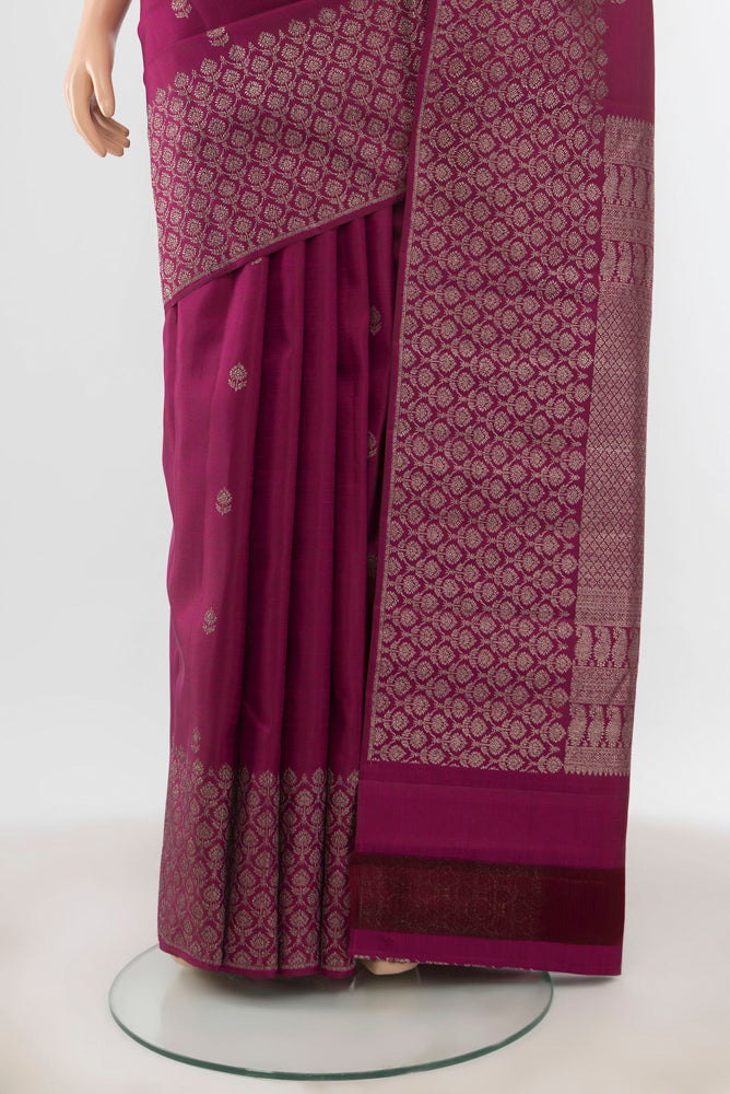Pleats and pallu of Purple Kanchipuram Silk Saree with Zari Butta on the body and Silk Border. 