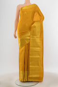 Pure Silk Pure Zari Yellow Kanjivaram Saree with Zari Butta on the body and Silk Border.  displayed on a mannequin