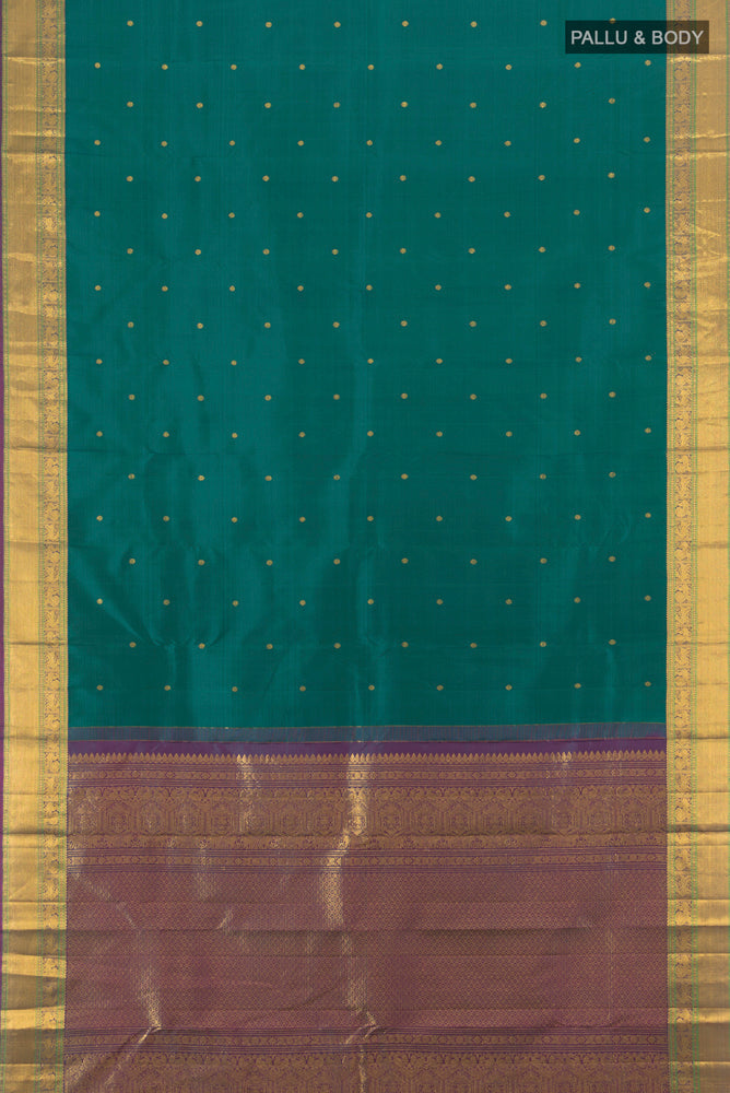 Flat view of Pure Silk Pure Zari Peacock Blue Kanjivaram Saree with Zari Butta on the body and Silk Border. 
