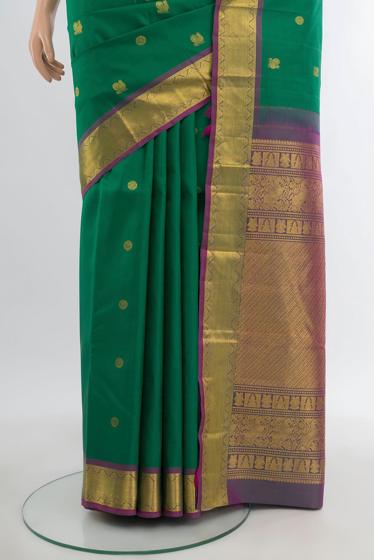 Pleats and pallu of Green Kanjivaram Silk Saree with Zari Butta on the body and Zari Border. 