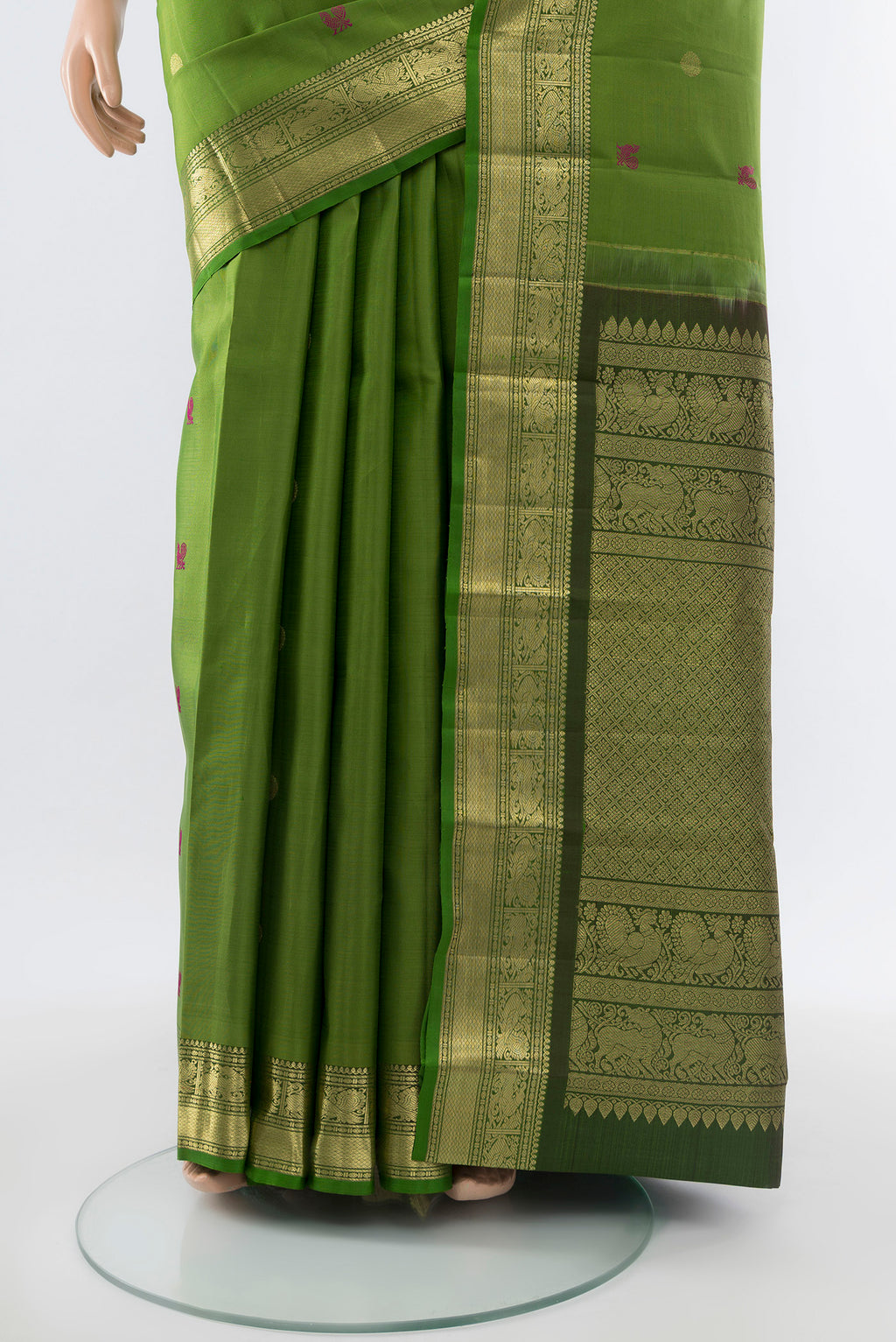 Pleats and pallu of Light Green Kanjivaram Silk Saree with Zari Butta on the body and Silk Border. 