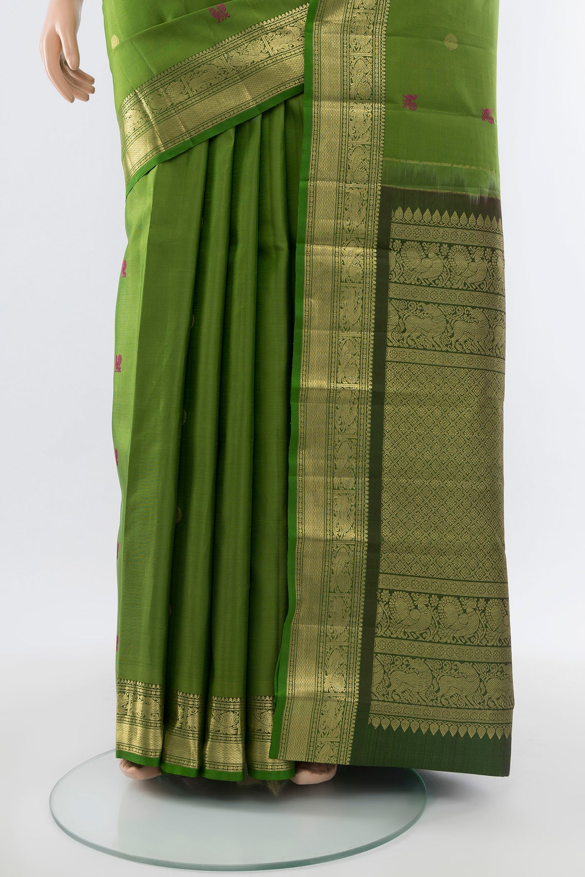 Pleats and pallu of Light Green Kanjivaram Silk Saree with Zari Butta on the body and Silk Border. 