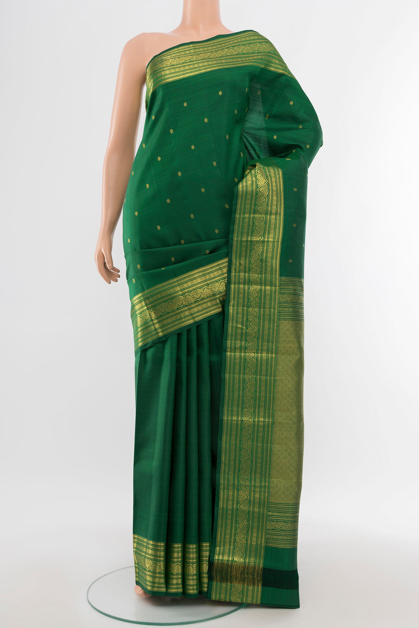 Pure Silk Pure Zari Mint Green Kanjivaram Saree with Zari Butta on the body and Silk Border.  displayed on a mannequin