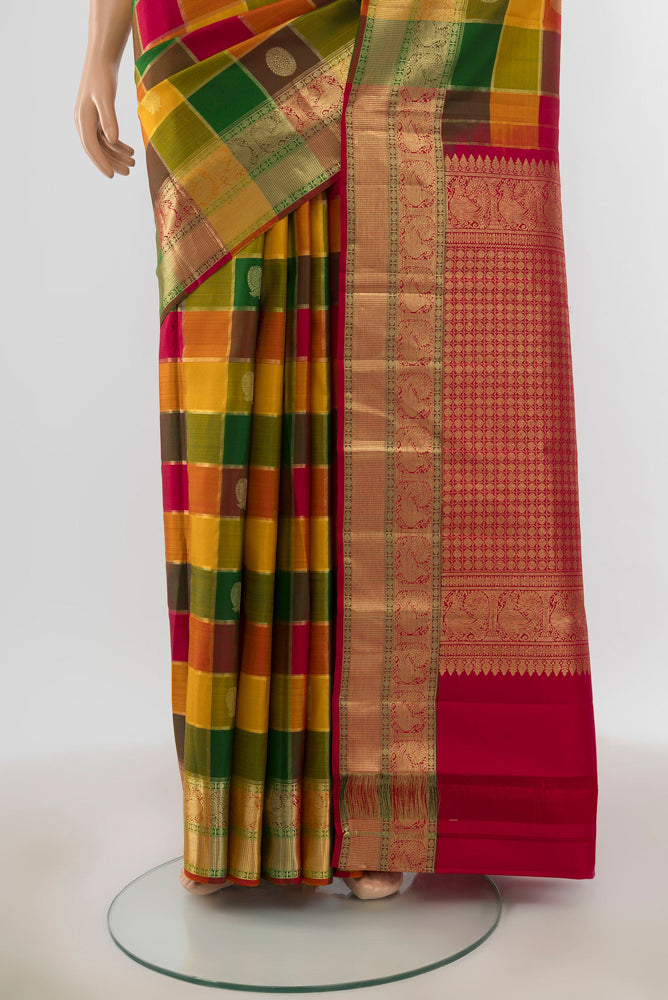 Pleats and pallu of Pure Silk Pure Zari Multi Color Kanjivaram Saree with Zari Butta on the body and Silk Border. 