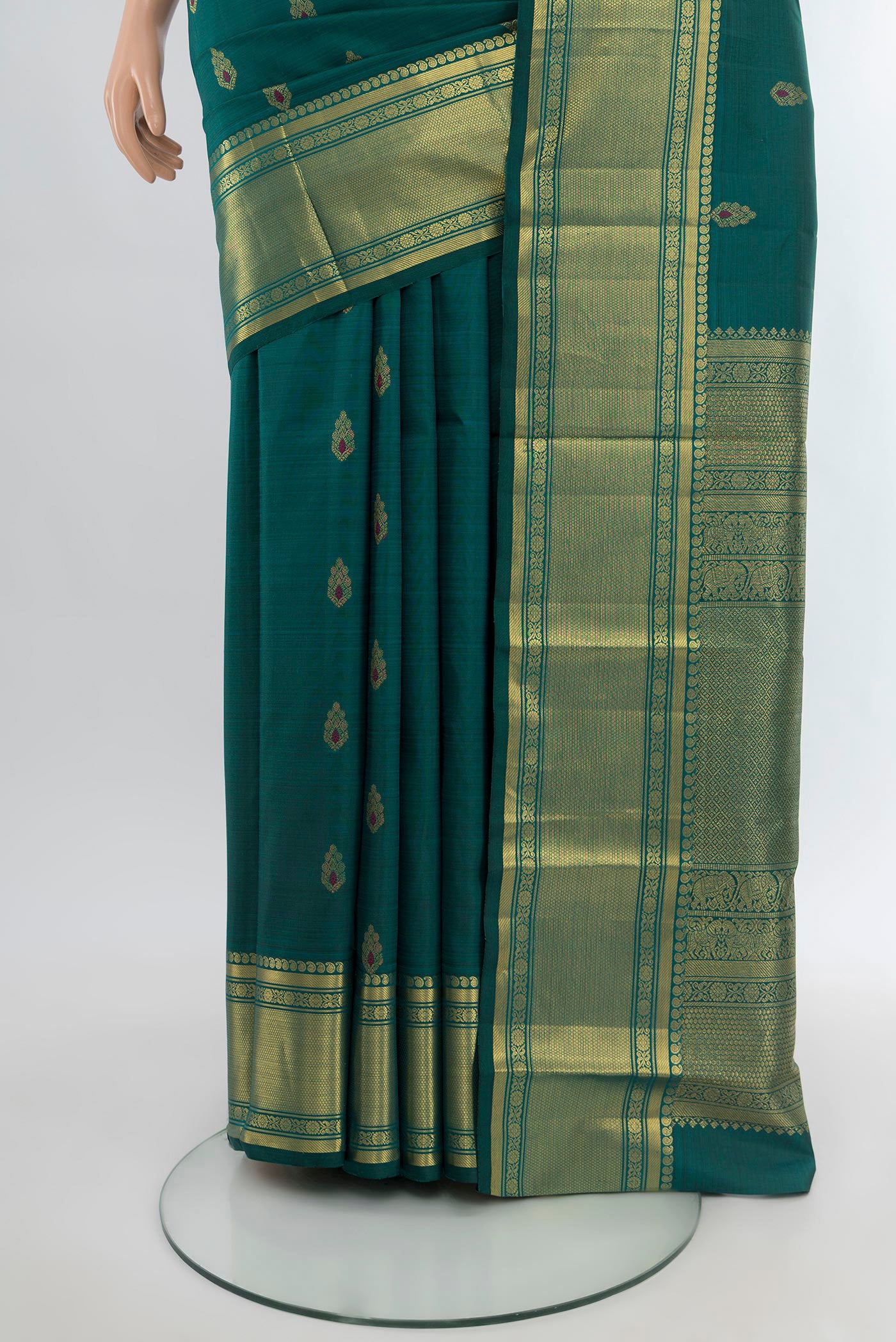 Pleats and pallu of Peacock Blue Kanjivaram Silk Saree with Zari Butta on the body and Zari Border. 